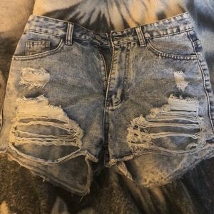 Raw ripped denim shorts